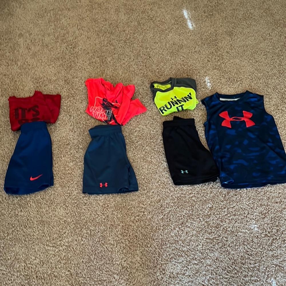 (3) matching shorts sets. Yellow one has a stain. 2 UA and 1 Nike set